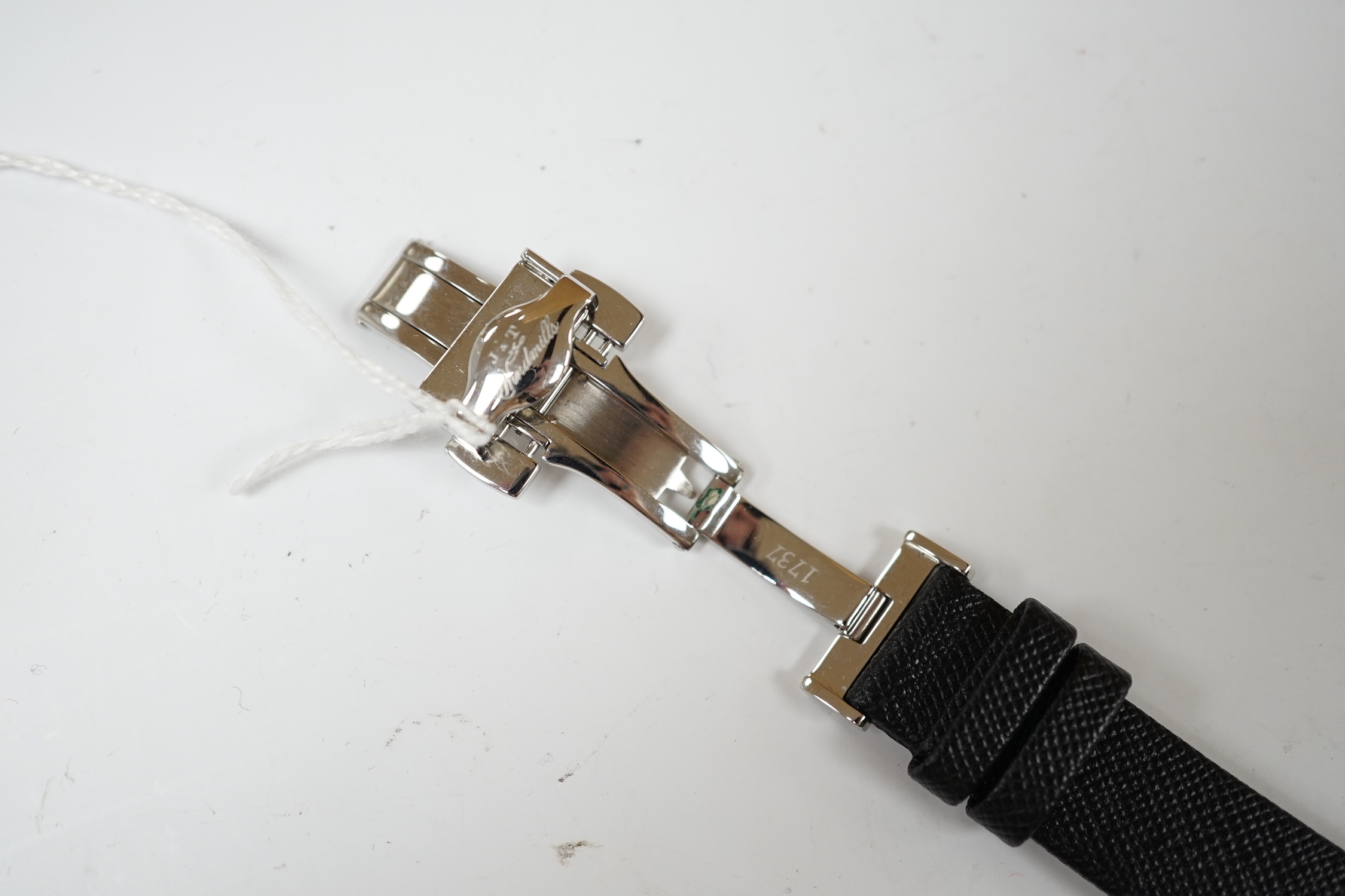 A gentleman's 2006 Joseph & Thomas Windmills Bartholomew First Edition white metal (stamped 950 for platinum) manual wind wrist watch, numbered 00144/00150, on leather strap with stainless steel deployment clasp, with or